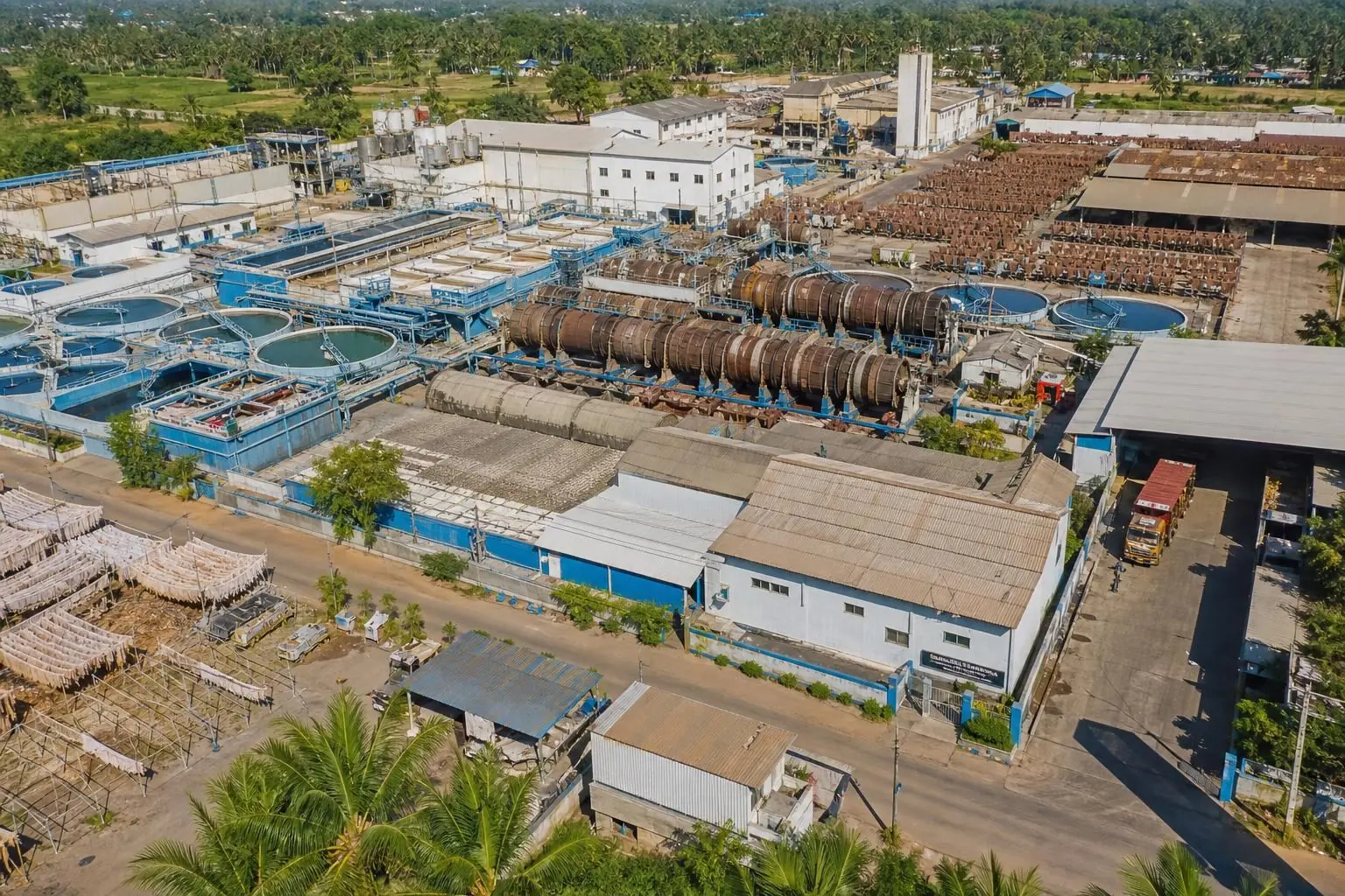 Aerial view of large integrated tannery facility with rows of processing drums